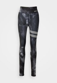 Svart och grå tie-dye leggings med hög midja, smal passform och mesh-strimmor på låret. Tillverkade av stretchigt, ventilerande material.