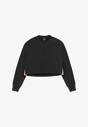 Black long-sleeve cropped sweatshirt with beige side panels and ribbed cuffs, featuring a small round logo near the hem.