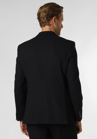 Black tailored blazer with a structured silhouette, smooth fabric texture, single vent at the back, and four-button detailing on the cuffs.