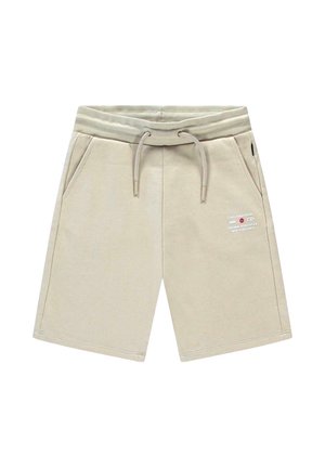 Beige knielange korte broek met geribbelde elastische tailleband, trekkoord, zijzakken en kleine bedrukt tekst op de rechterdij.