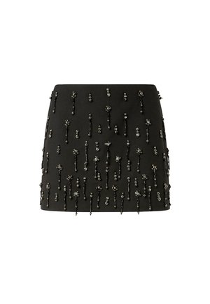 Gonna nera con silhouette aderente, arricchita da decorazioni con perline a motivi floreali e lunghezze variabili sulla superficie.