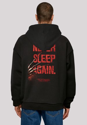 Black hooded sweatshirt featuring a graphic design on the back with red text "NEVER SLEEP AGAIN" and a clawed hand, made of cotton blend.