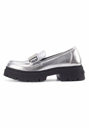 Silver metal loafers with a chunky black outsole, featuring a rectangular buckle detail and smooth, shiny texture.