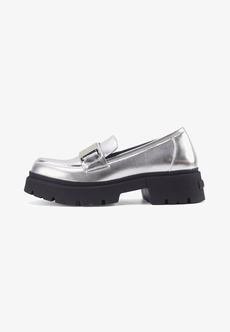 Silver metal loafers with a chunky black outsole, featuring a rectangular buckle detail and smooth, shiny texture.