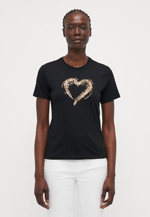 T-shirt noir à manches courtes avec un design de cœur en sequins dorés et argentés au centre. Encolure ronde classique et en coton doux.