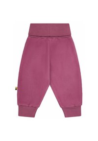 Pantaloni jogging in pile di un intenso colore rosa. Presentano una vita elastica e polsini a costine. Tessuto morbido con una vestibilità rilassata.