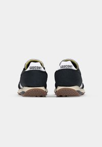 Black suede running shoes with a textured upper, white accents, a cushioned collar, and a patterned rubber outsole for traction.