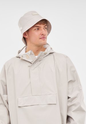Light gray waterproof jacket with a front pocket, adjustable hood, and matching light gray bucket hat made of smooth fabric.
