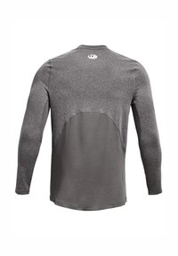 Grå langermet treningsskjorte med teksturert overdel og glatt underdel, med rund hals og en logo bak nær halsen.