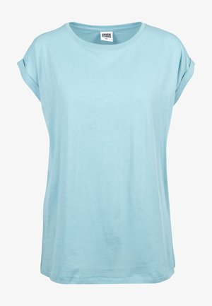 Light blue t-shirt made from soft cotton. Features short rolled sleeves, a round neckline, and a relaxed fit with a simple design.