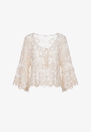 Crèmekleurige gehaakte kanten blouse met bloemmotief, driekwart wijde mouwen, ronde hals en voorstrik met tassels.
