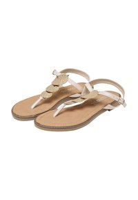 Beige flade sandaler med tynde remme og gyldne, bladformede dekorative detaljer langs toppen, spænde ved anklen.