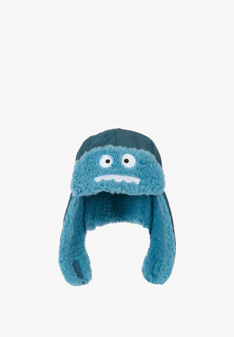 Cappello invernale blu in peluche con fodera pelosa, caratterizzato da un design facciale con due occhi e una bocca, esterno blu scuro, alette per le orecchie.