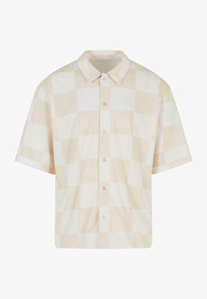 Világos bézs, rövid ujjú, gombos ing nagyméretű kockás mintával. Klasszikus gallérral és elülső gombokkal rendelkezik. Simább anyagú textúrával.