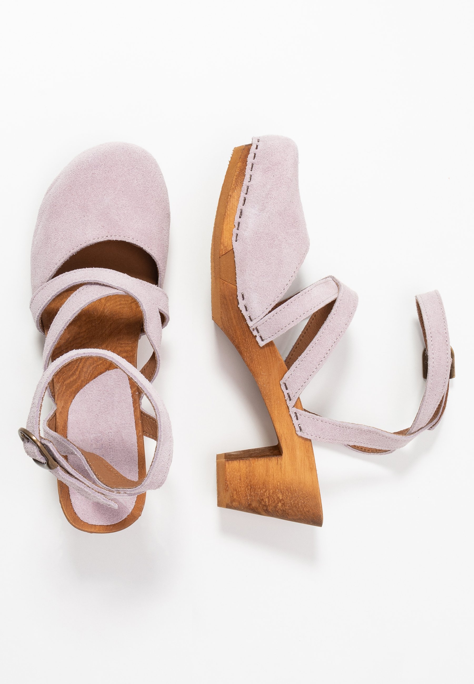 sanita tinja clogs