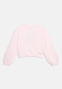 Cropped pink knitted sweater with long, balloon sleeves, ribbed hem, and smooth texture; plain design, no patterns or accents.