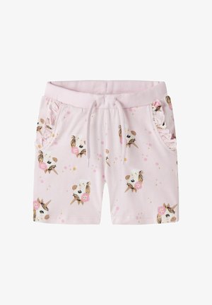 Shorts pour enfants rose clair avec des visages de licornes, des fleurs roses, une taille à cordon et des bords de poche froncés des deux côtés.