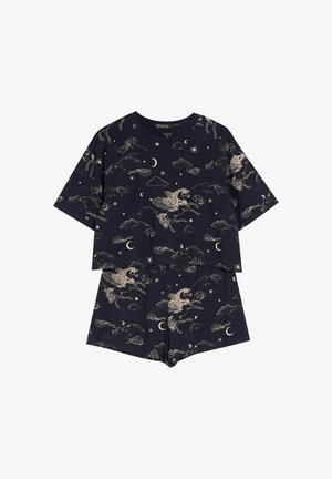 Granatowa bluzka z krótkim rękawem i szorty w beżowe wzory z pegazami, gwiazdami, księżycami oraz chmurami.