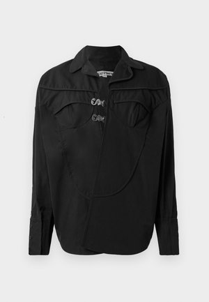 Fekete gombos ing, strukturált elülső résszel, átfedési részletekkel, dupla mellzsebbel és gallérral. Simaságú anyagból készült, matt felülettel.