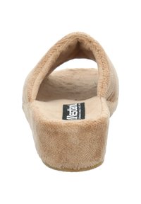 Beigefarbene Plattformslipper mit weichem, strukturiertem Obermaterial, offener Rückseite und robuster Gummisohle. Verfügt über ein Markenlabel auf der Innensohle.