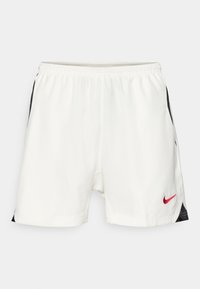 Hvite sportsbukser med svarte sidestrek, elastisk midje og rød Nike-logo nederst på fronten. Glatt, lett stoff.