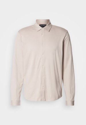 Light beige long-sleeve shirt with a classic collar, front button closure, and cuffed sleeves, made from soft fabric with a smooth texture.