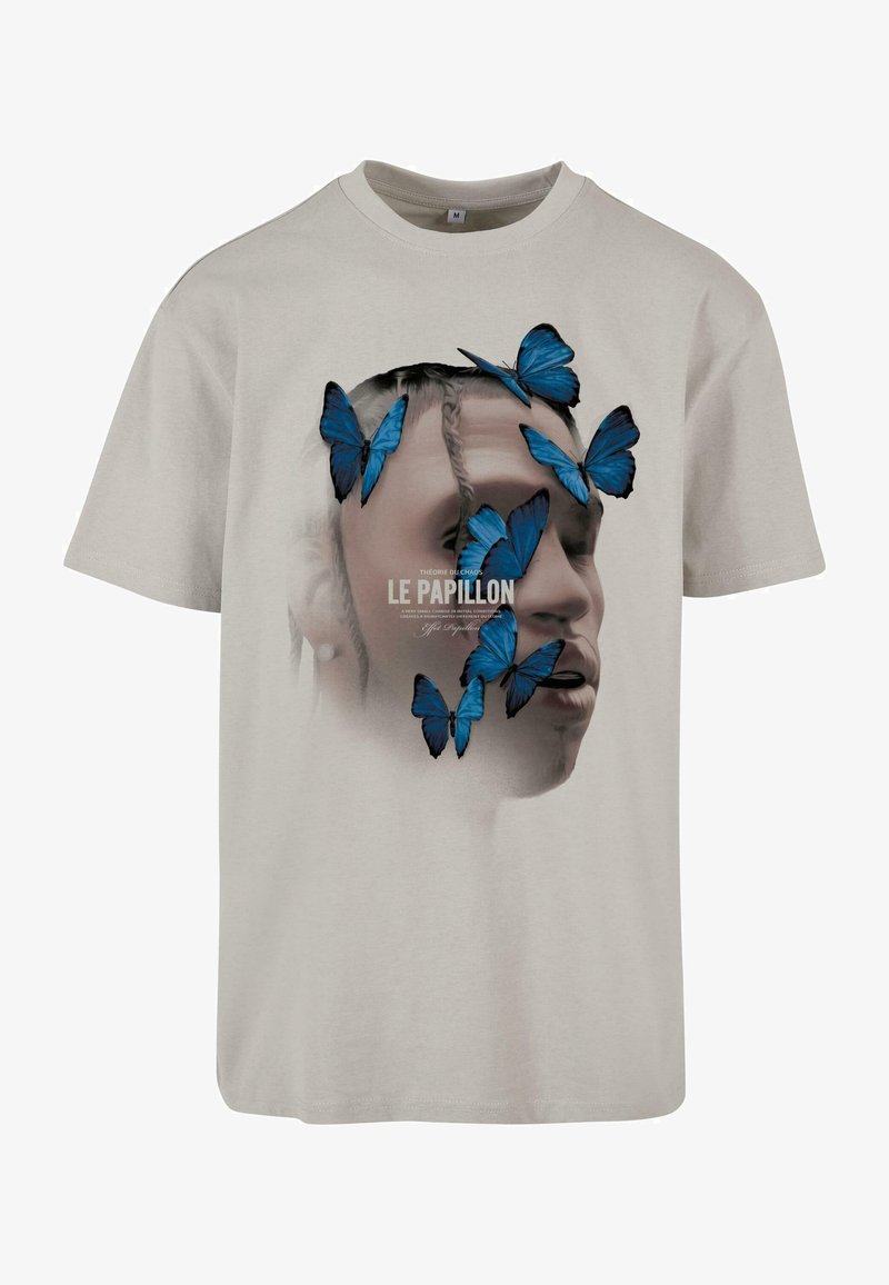 Heledast hall puuvillane T-särk, millel on graafika näost, mida ümbritsevad sinised liblikad ja alltekst "LE PAPILLON".