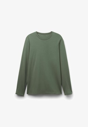 Langarmshirt in Dunkelgrün aus weichem Stoff. Mit rundem Ausschnitt, lockerem Schnitt und seitlichen Saumschlitzen für mehr Bewegungsfreiheit.