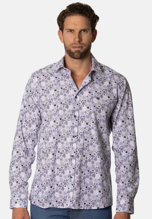 Camisa de manga larga de color púrpura claro con un patrón de diseños circulares y florales en azul y negro, que cuenta con un cuello abotonado y un logo bordado.