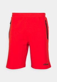 Pantalones cortos deportivos rojos con cintura elástica, dos bolsillos laterales con cremallera y pequeño logo negro de ellesse en la pierna izquierda.