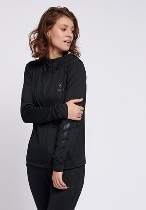 Black zip-up athletic jacket made from soft, lightweight fabric. Features a hood, side pockets, and textured accents on the sleeves.