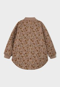Giacca marrone con motivo floreale e orlo arrotondato, caratterizzata da un design trapuntato, polsini a coste e colletto a coste beige.