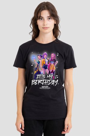 Young woman wearing black T-shirt with colorful animated female characters and text "It's My Birthday" and "K-Pop Demon Hunters."