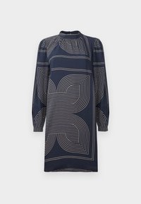 Abito della Marina realizzato in tessuto morbido con motivi geometrici beige, maniche lunghe, scollatura alta e dettagli arricciati sulle spalle.