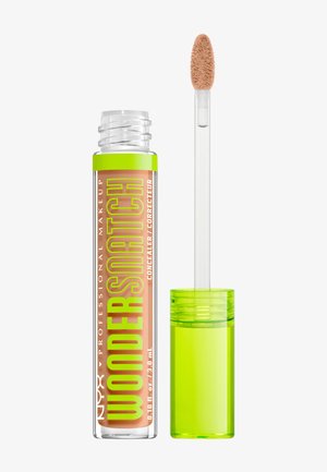 Klare Tube des NYX Professional Makeup Wondershade Concealers mit grünem Deckel und Applikatorstab, die beige Creme zeigt.