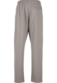 Graue Sweatpants mit einem elastischen Bund, geraden Beinen und einer Gesäßtasche. Hergestellt aus weichem, dehnbarem Material mit einer glatten Textur.