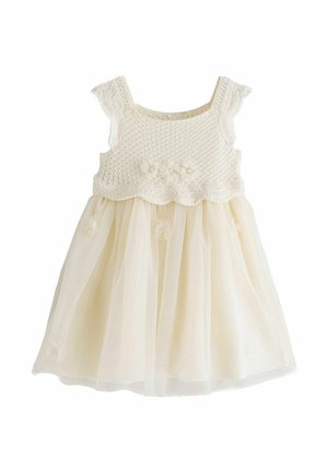 Krémové detské šaty s háčkovaným živôtikom, zvončekovitými rukávmi, kvetinovými aplikáciami a tylovou sukňou.