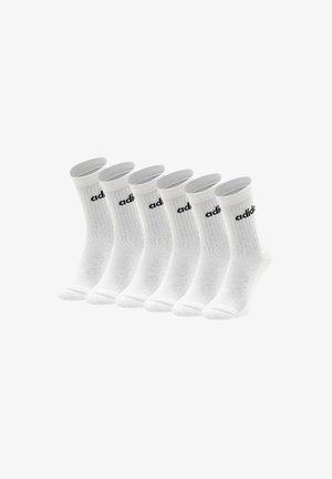 Weiße Sportsocken mit geripptem Muster, ausgestattet mit einem schwarzen Logo am Bund. Verpackung mit sechs Paaren, Knöchellänge.