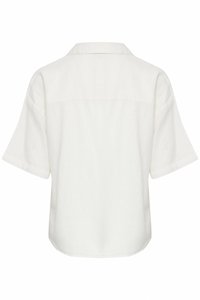 Chemise blanche à manches courtes avec un col classique, une coupe ample et un ourlet incurvé, vue de dos sur un fond blanc.