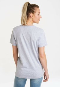 Gray cotton t-shirt with a round neckline, short sleeves, and a relaxed fit, viewed from the back.