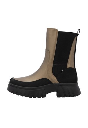 Bottes montantes avec un devant en métal doré, des panneaux latéraux en tissu noir et une semelle à crampons. Comprend une languette à l'arrière pour un enfilage facile.