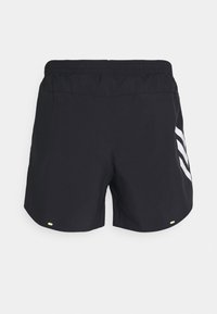Shorts de sport noirs avec une taille élastique, présentant un design de logo réfléchissant sur le côté gauche et un petit accent réfléchissant à l'arrière.