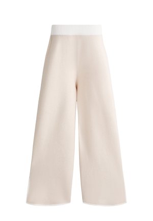 Wide-leg trousers in soft, light beige fabric, featuring a ribbed white waistband and clean lines, with no visible fastenings or pockets.
