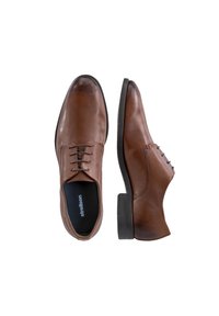 Scarpe in pelle marrone con finitura liscia, dotate di design con lacci, punta rotonda e tacco nero basso. Presentano dettagli di cucitura visibili.