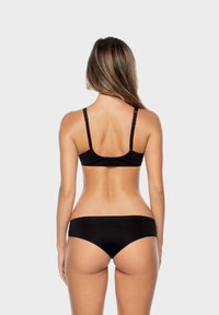 Black bra and matching bikini bottom made of smooth fabric. The bra features adjustable straps; the design is minimalistic with no patterns.