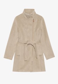 Beige, vyölitty takki korkealla kauluksella, valmistettu pehmeästä kankaasta. Varustettu vetoketjullisella taskulla ja tyylikkäällä muotoilulla, jossa on pitkät hihat ja minimaalista ompelua.