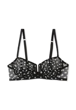 Reggiseno nero a pois realizzato in rete trasparente. Presenta ferretti, spalline regolabili e un design geometrico al centro davanti.