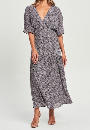 Robe longue à imprimé floral avec un décolleté en V profond, des manches courtes bouffantes et une jupe à volants. Le tissu est léger et fluide.