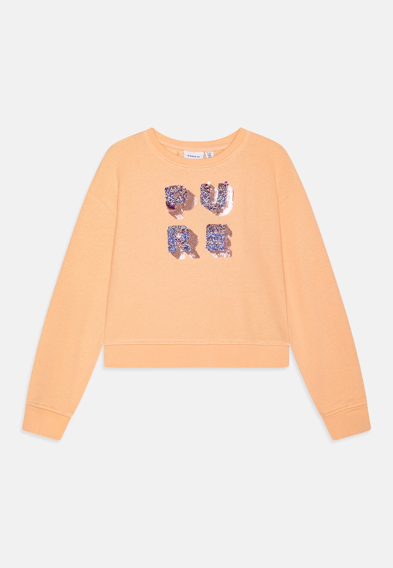 Persikofärgad bomulls sweatshirt med långa ärmar och ribbade muddar. Dekorativt paljetttryck med texten "PURE" i olika färger på framsidan.