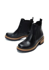 Botas de tobillo de cuero negro con paneles elásticos laterales, punta redondeada y un tacón cuadrado en color marrón contraste. Presentan una suela de goma texturizada y detalles de costura.